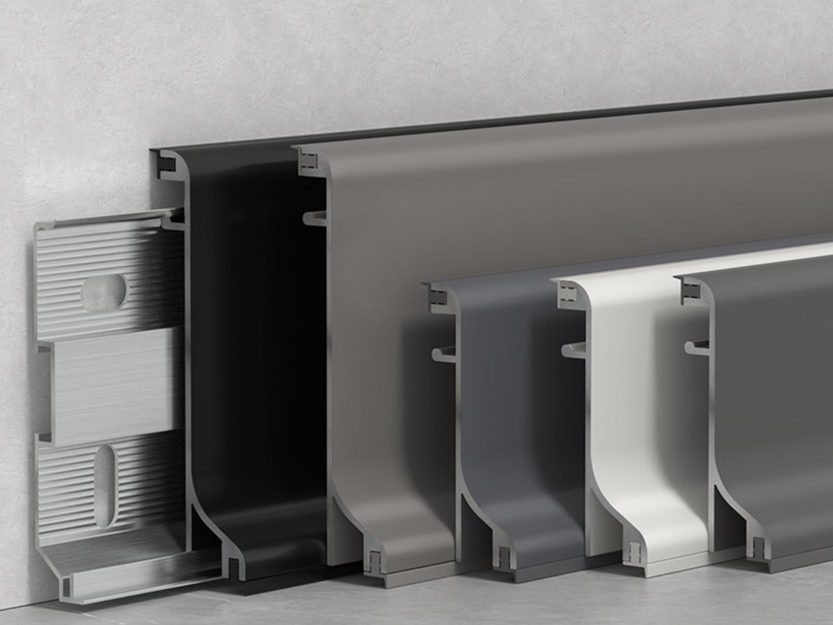 Dual-seal aluminium skirting installed against wall and floor