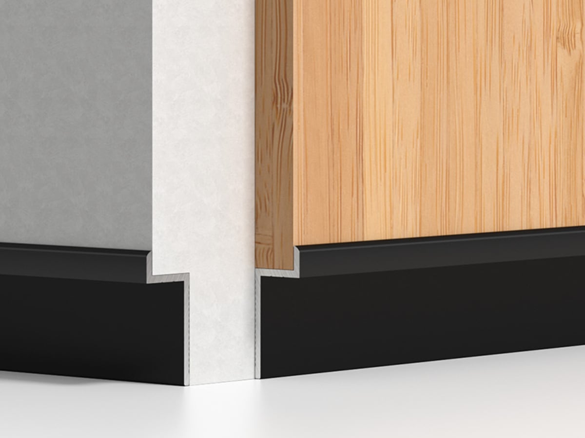 Standard recessed black aluminium skirting at an internal corner