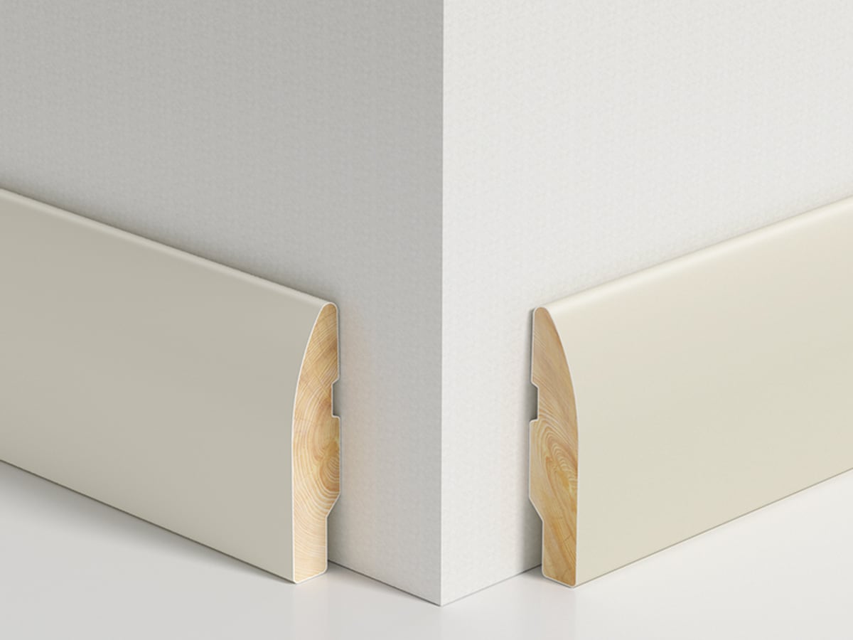 Decorative solid wood skirting installed around an internal corner